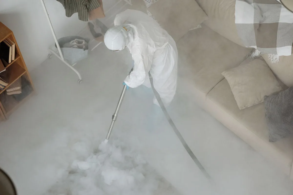 Biohazard cleanup technician in protective equipment, Hamilton, NY